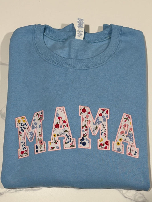 Mama Embroidered sweatshirt with floral fabric appliqué.